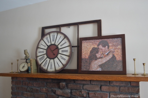 Rustic mantel with window pane and clock 